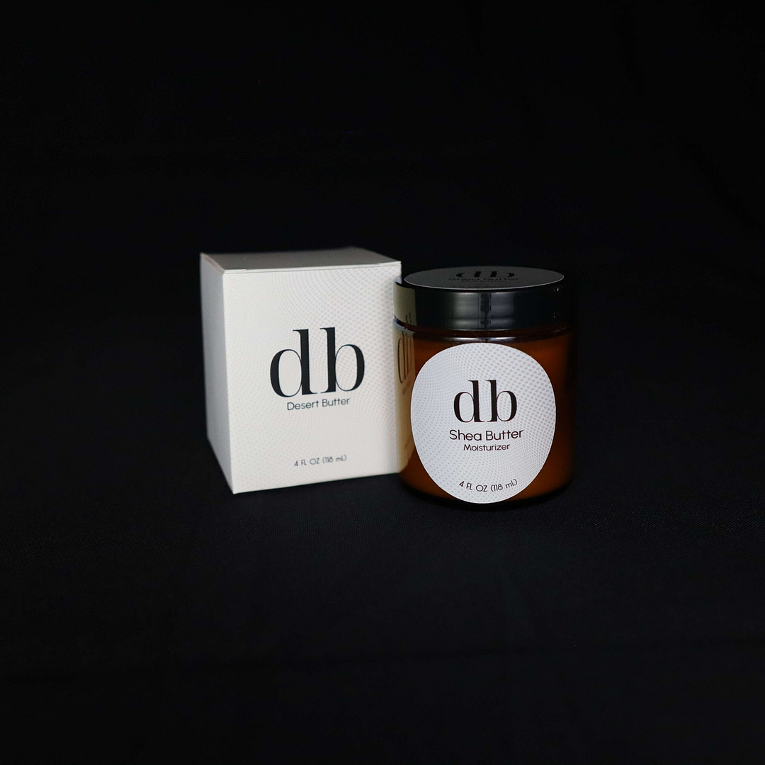 Photo of 4 ounce jar of db Shea Butter moisturizer beside its box